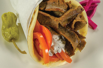 Gyro wrap sandwich. Greek flat bread gyro wrap.